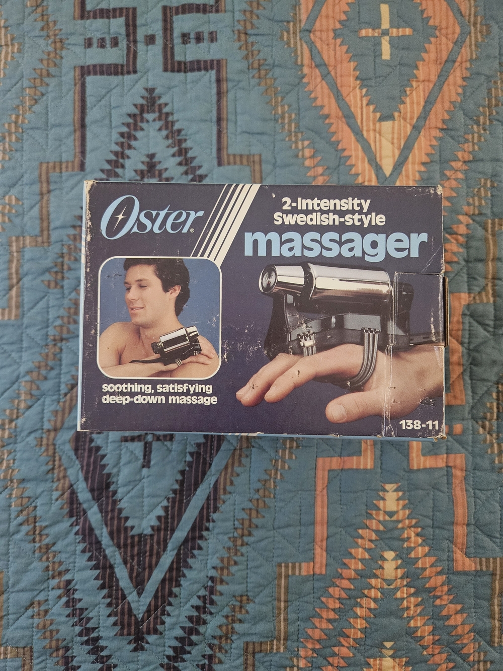 Oster light blue and purple Swedish-Style Massager Box